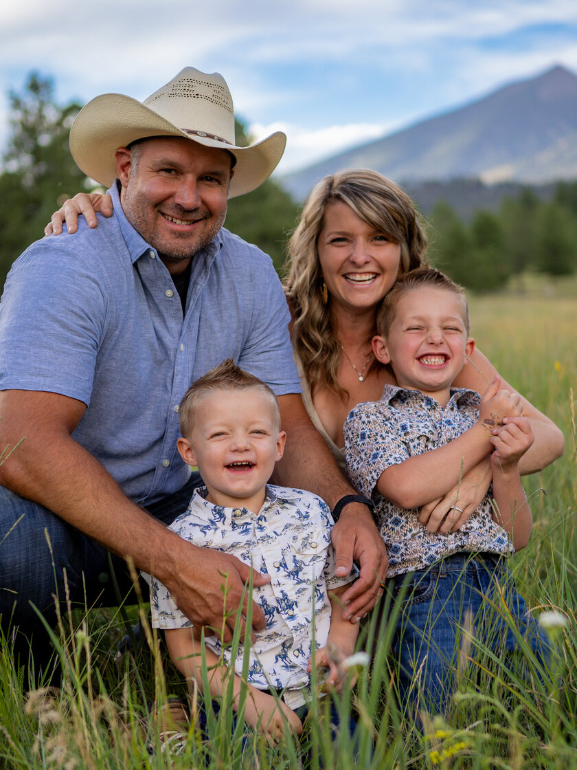 Kyle Kent with his family in a mountain meadow near Flagstaff, Arizona